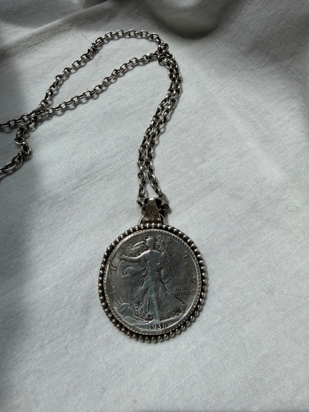 Walking liberty half dollar pendant