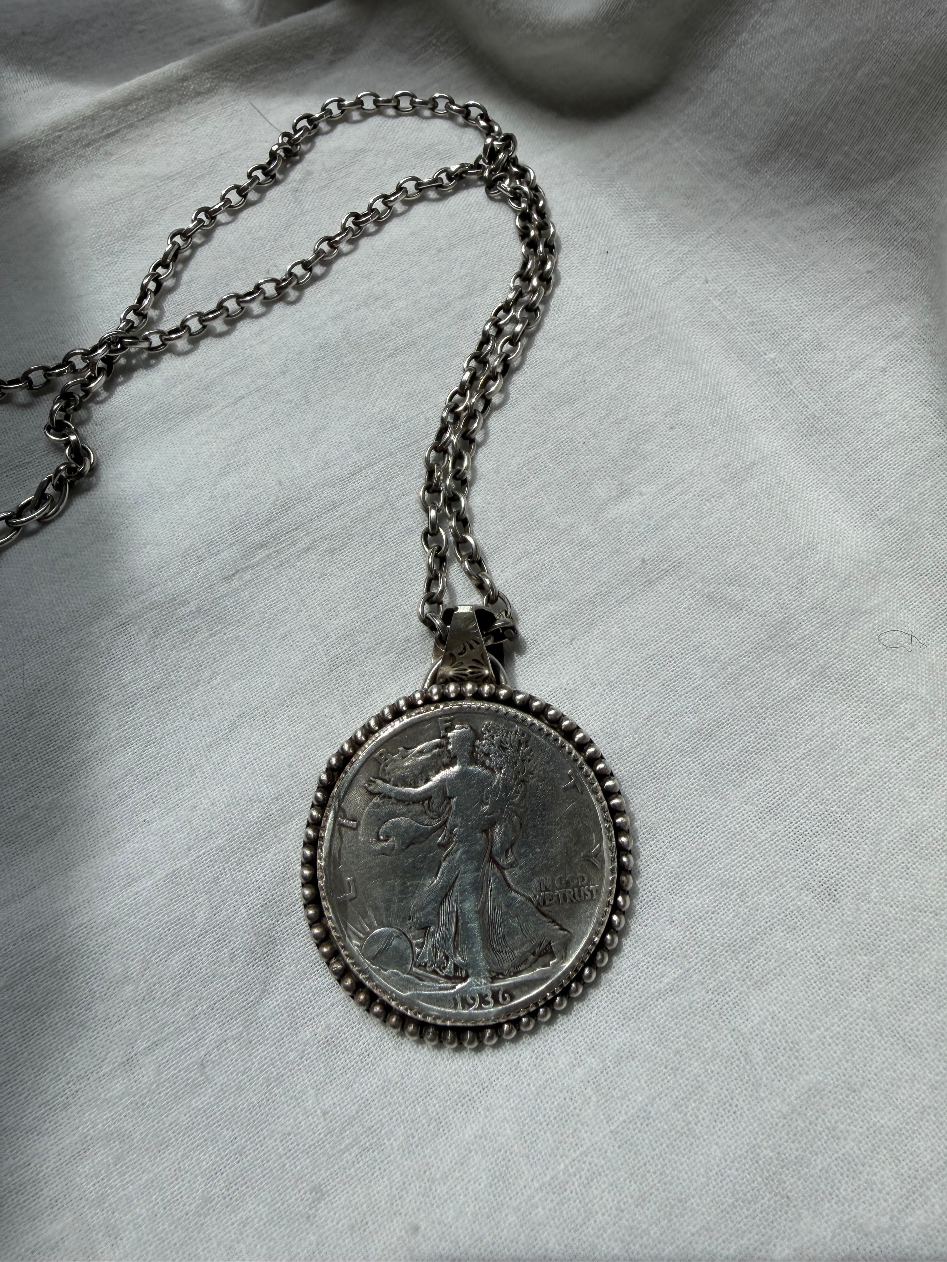 Walking liberty half dollar pendant