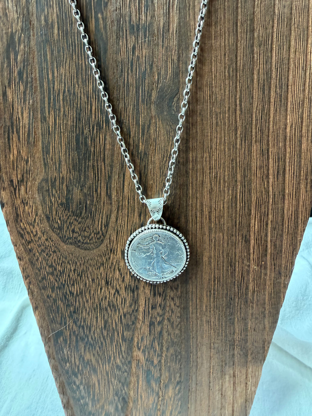 Walking liberty half dollar pendant